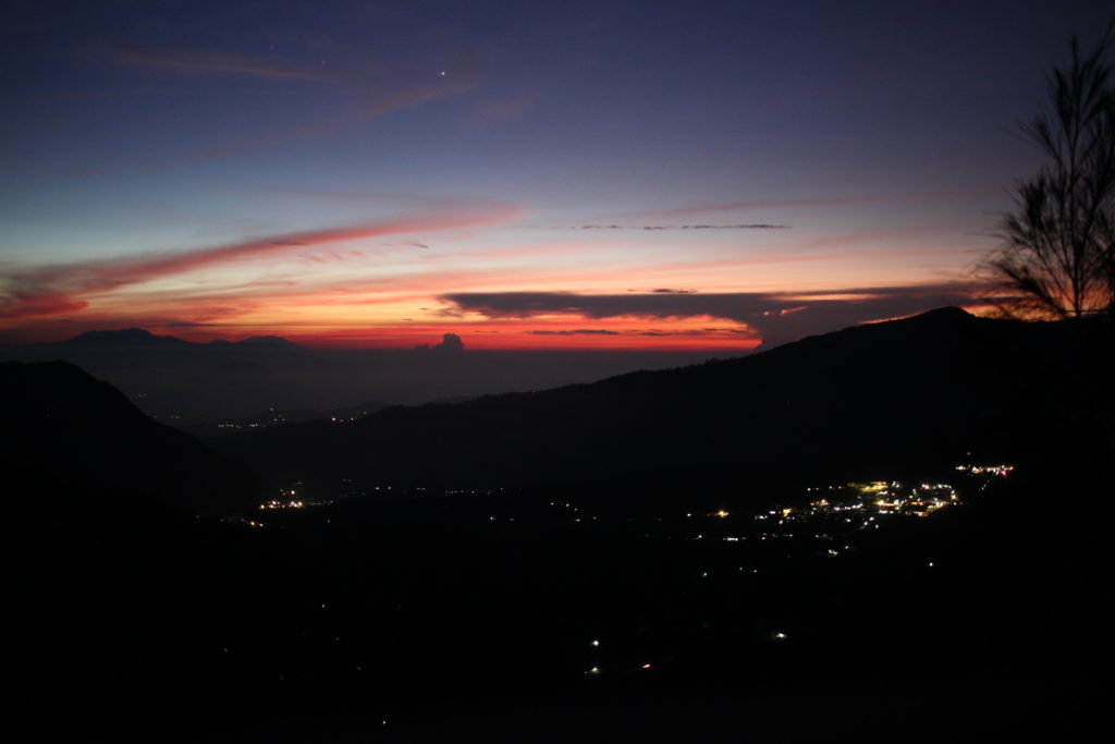 Mount Bromo sunrise over the village, Indonesia