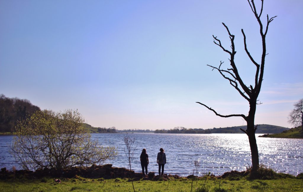 Standing on the shores of Lough Gur, Ireland