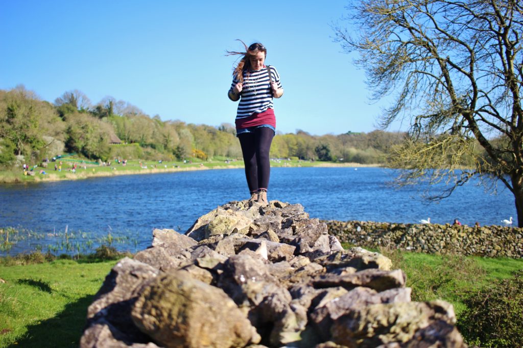 Walking on an old stone wall at Lough Gur, Ireland