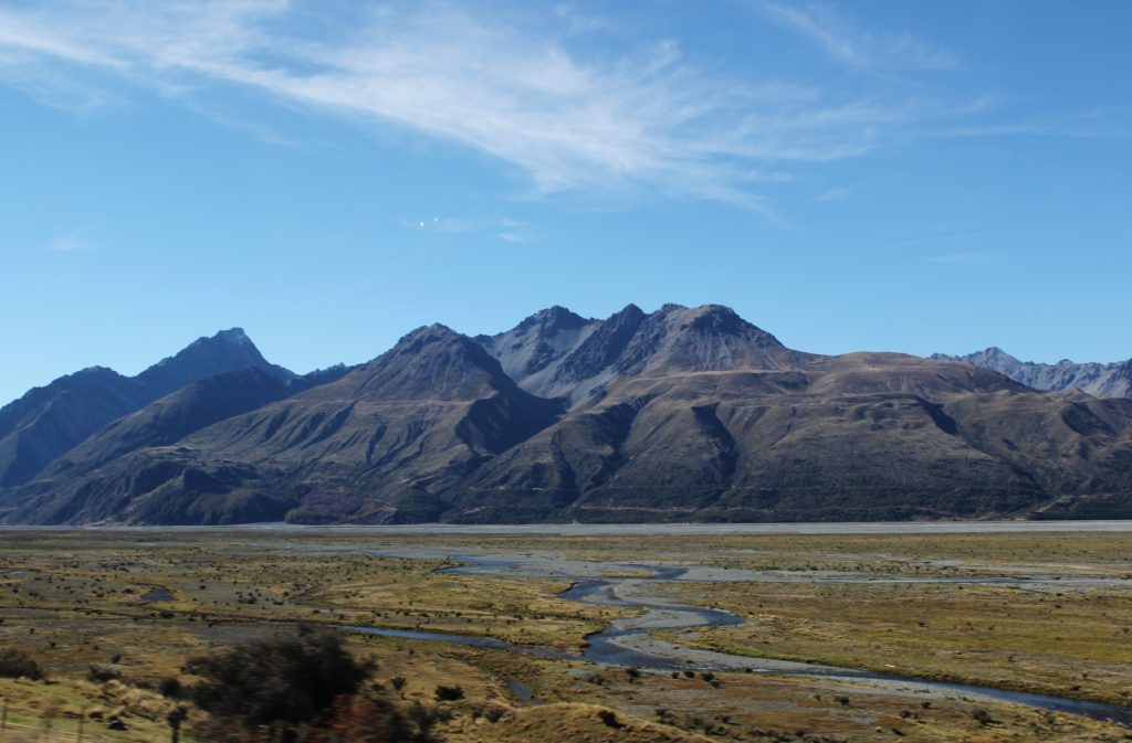 A river snakes through wetlands at Aoraki/Mount Cook, New Zealand