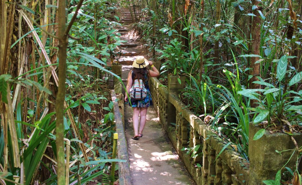 Wandering across a bridge at Paronella Park, Australia