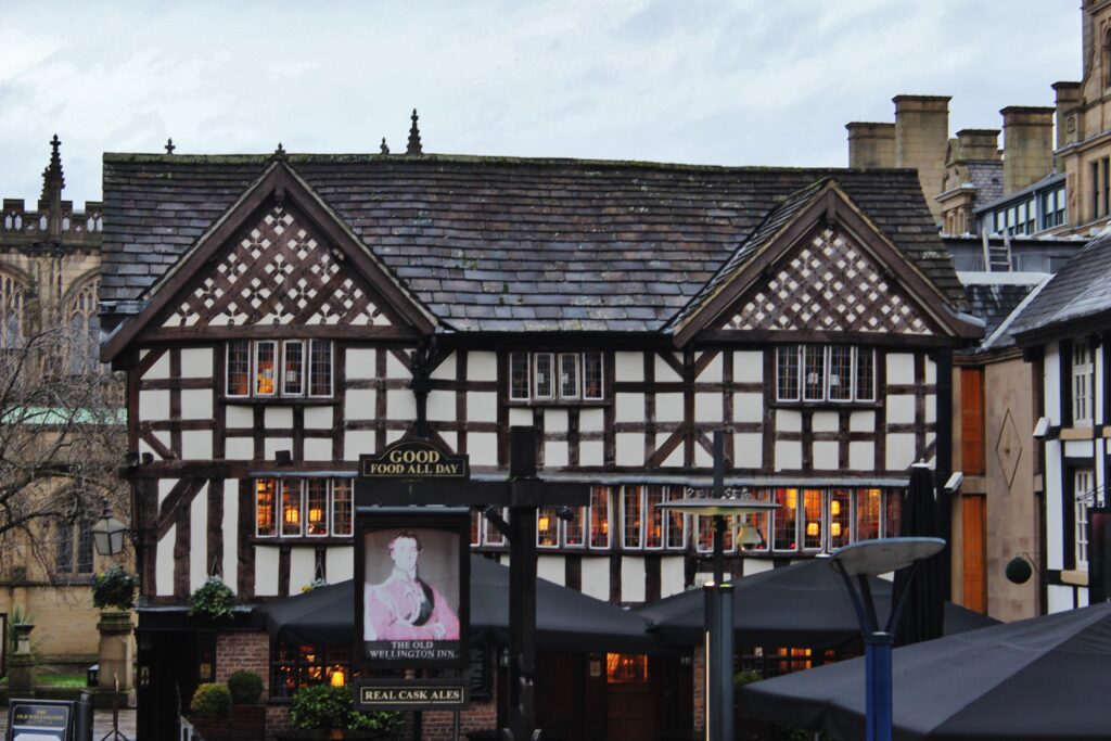 The Old Wellington Inn with Tudor-style architecture in Manchester