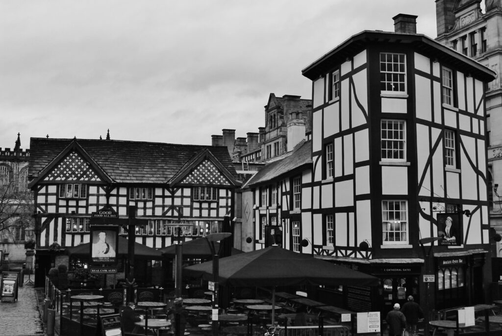 Two Tudor-style buildings in Shambles Square in Manchester