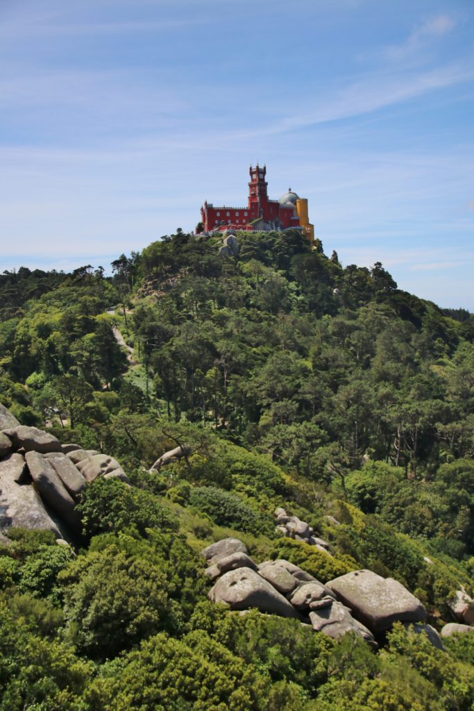 Pena Palace sitting on the mountain top in Sintra, Portugal