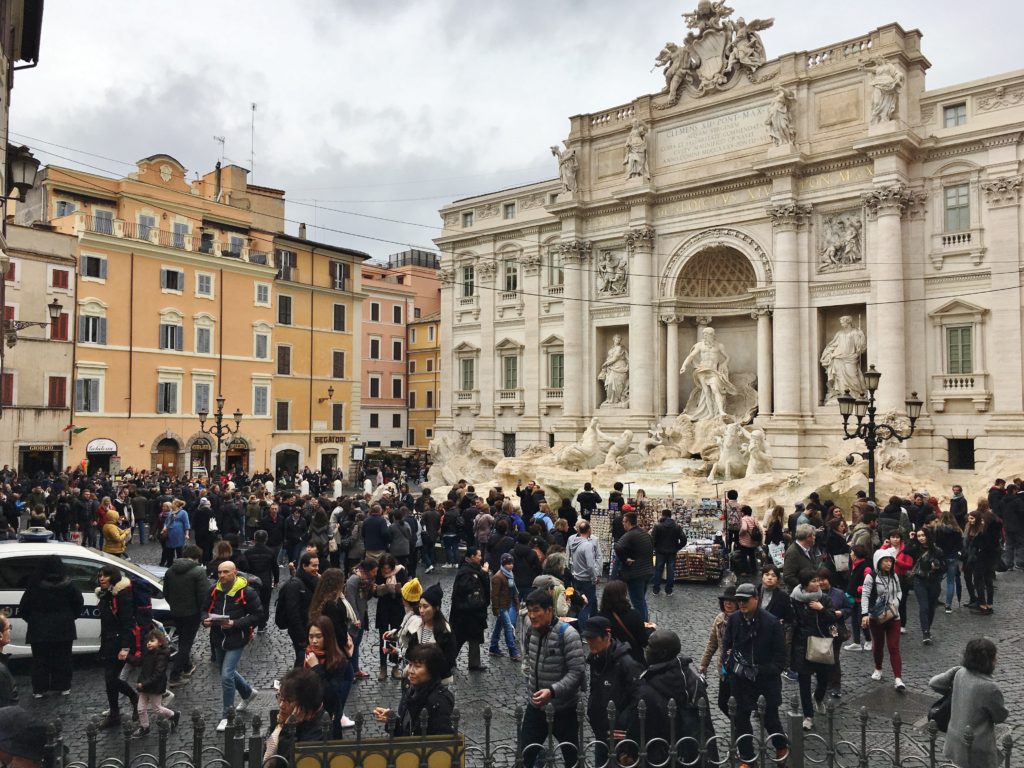 The large crowd at the Trevi Fountain in Rome, Italy