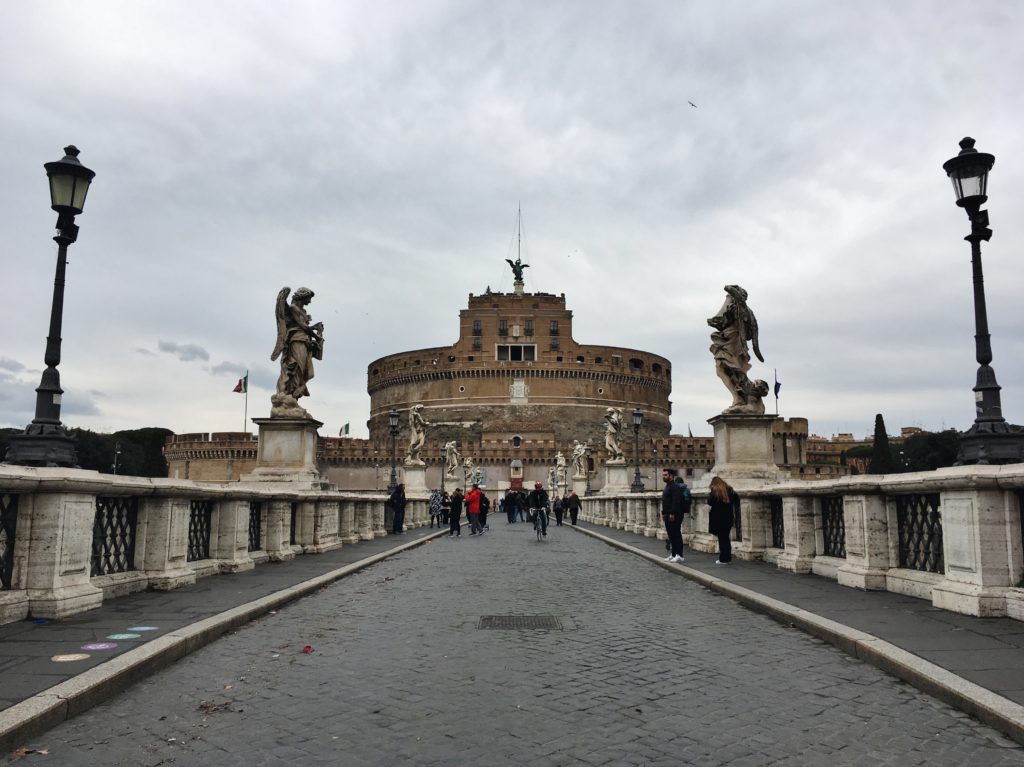 Crossing the bridge towards Castel Sant' Angelo in Rome, Italy