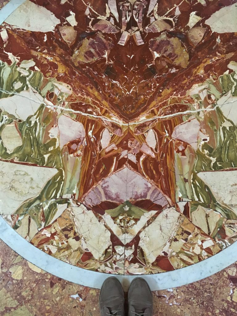 A decorative marble floor in the Vatican Museums