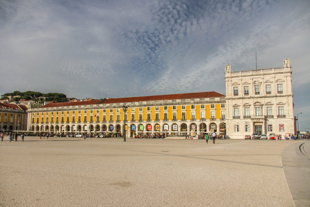 The yellow buildings of Praça do Comércio, in Lisbon, Portugal