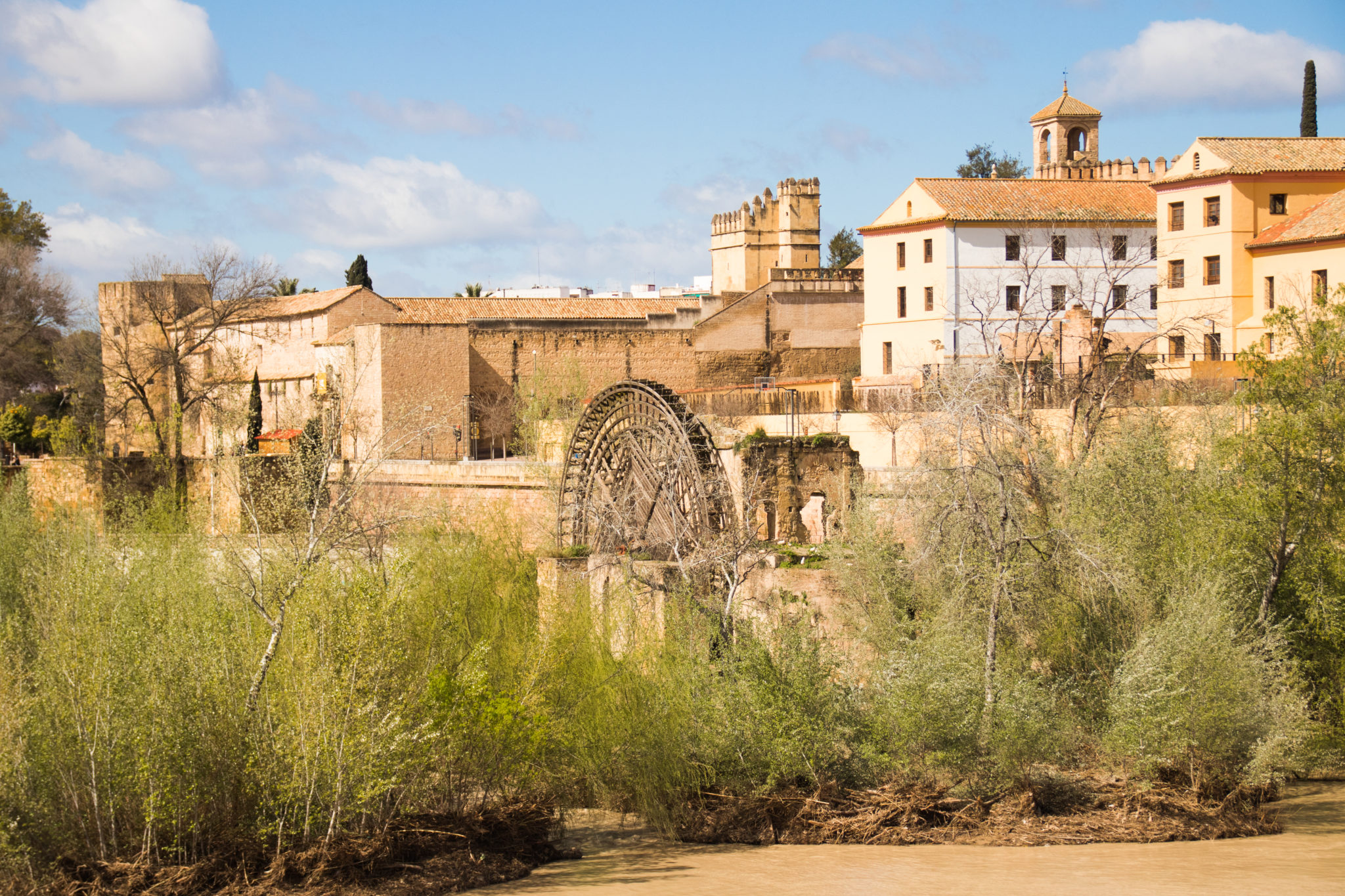 The view downriver from the Roman Bridge in Córdoba, Spain