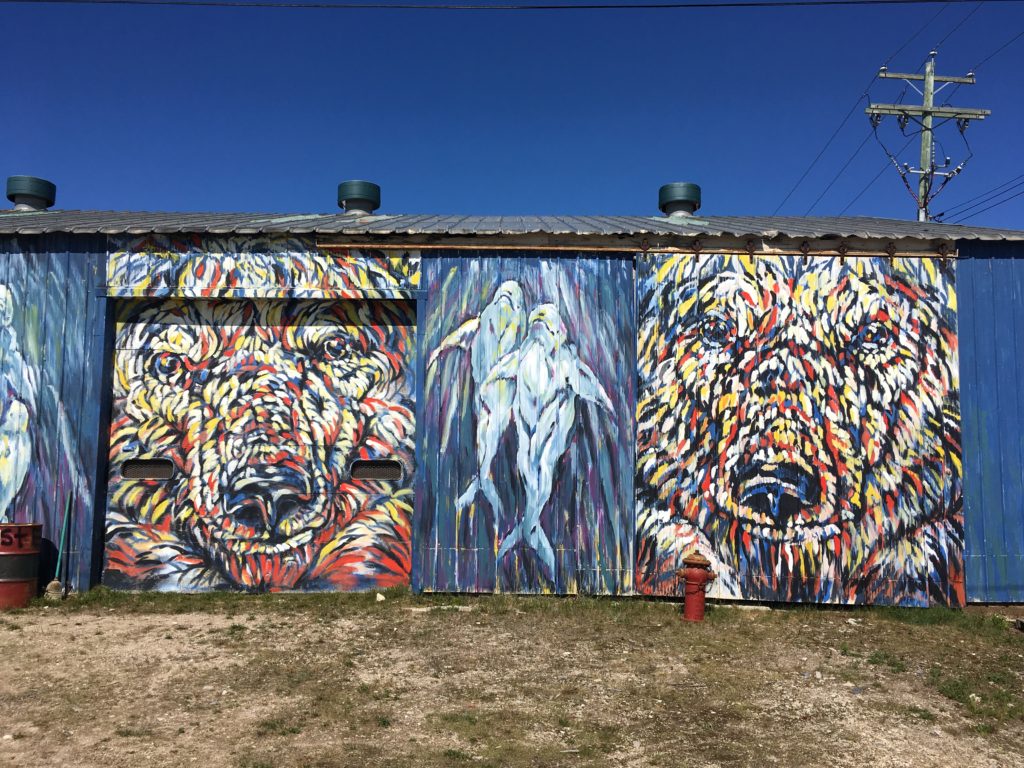 A colourful mural of bears and belugas in Churchill, Canada