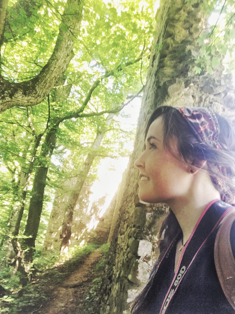 Taking in the beautiful forest by the ruined fortress in Saschiz, Romania