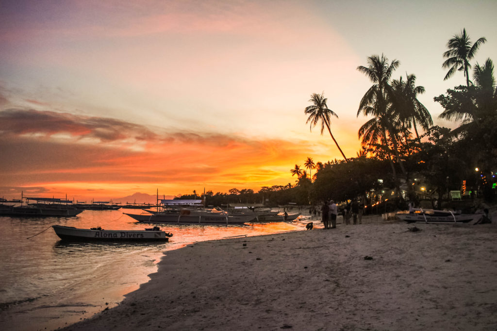 Sunset at Alona Beach on the island of Bohol in the Philippines