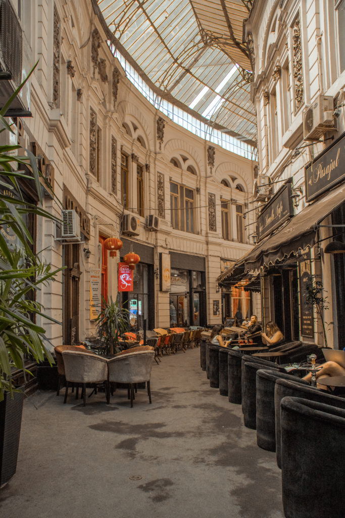 A curving covered passageway in Bucharest, Romania