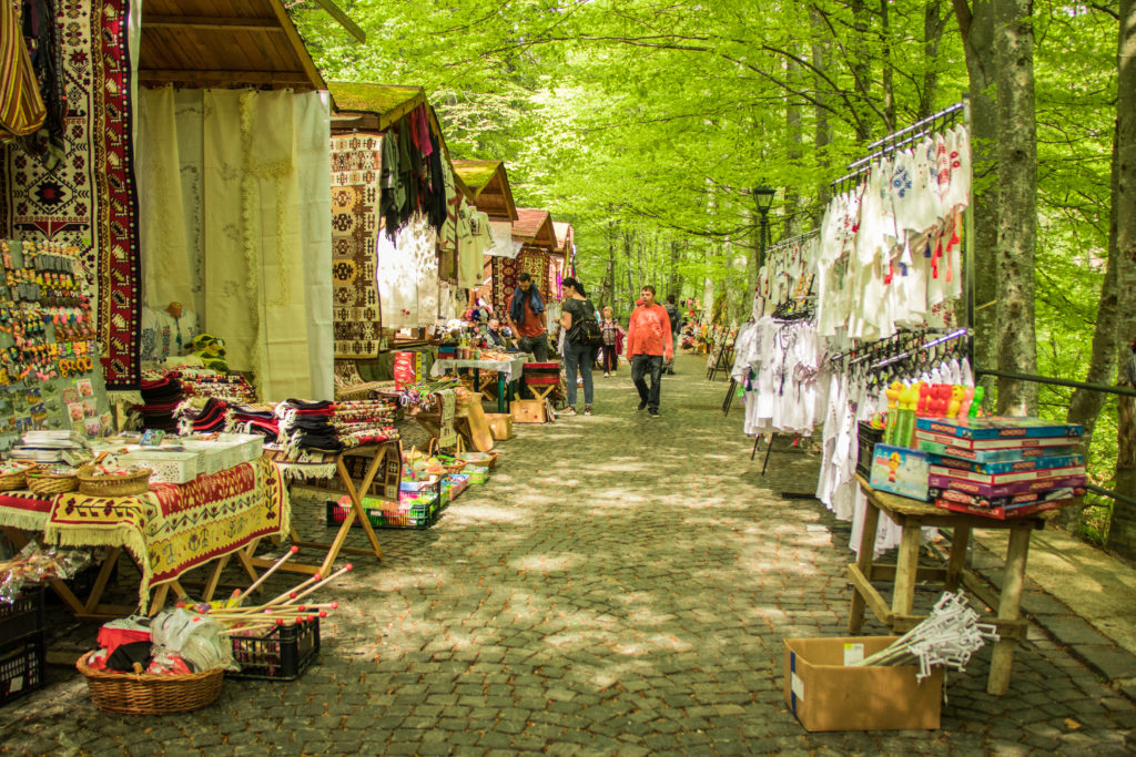 Stalls selling souenirs on the path to Peles Castle, Romania