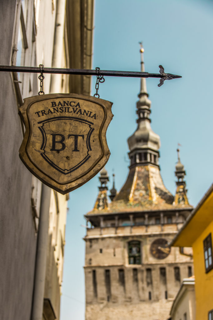 Old sign for the Bank of Transylvania hanging in Sighisoara, Romania