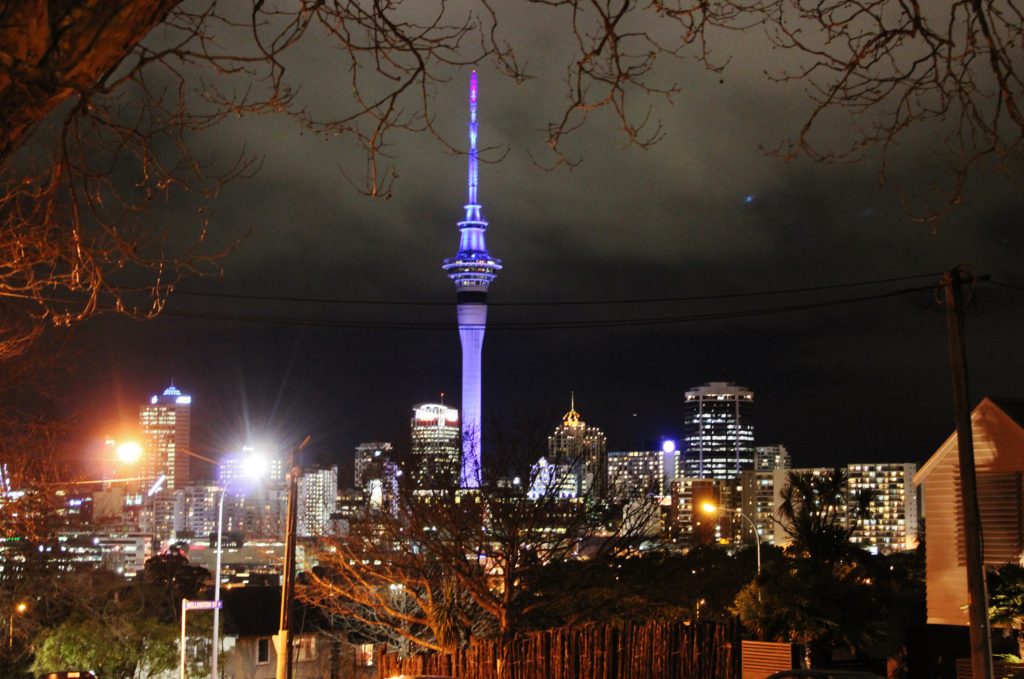 The skyline of Auckland lit up at night, New Zealand