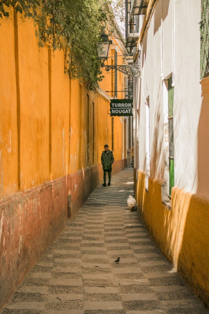Bright yellow walls in the Barrio Santa Cruz, one of the most beautiful places in Seville