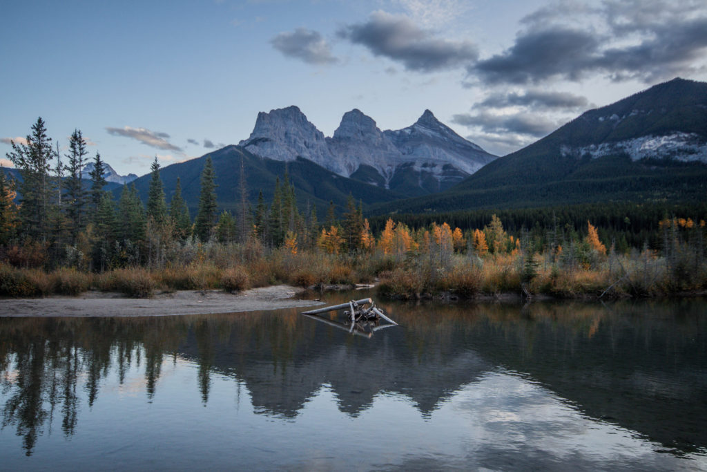This quintessential view of the Three Sisters mountains is a must-do Banff bucket list item for any photographer
