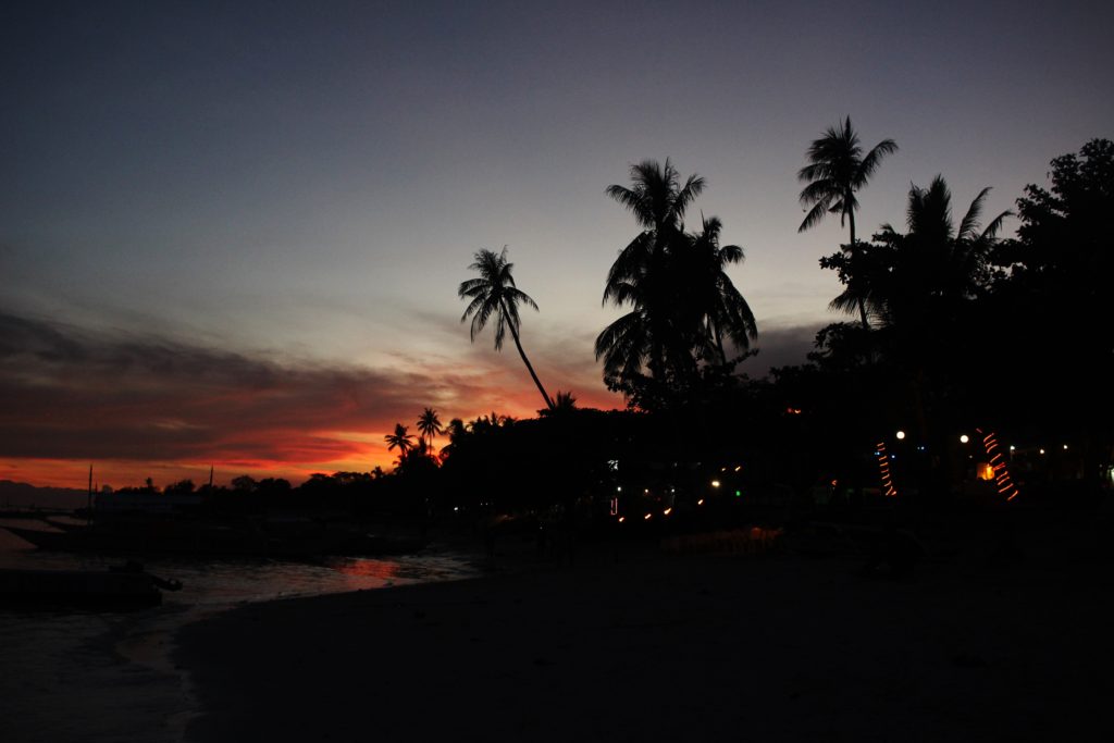 Sunset over Alona Beach, on Panglao in the Philippines