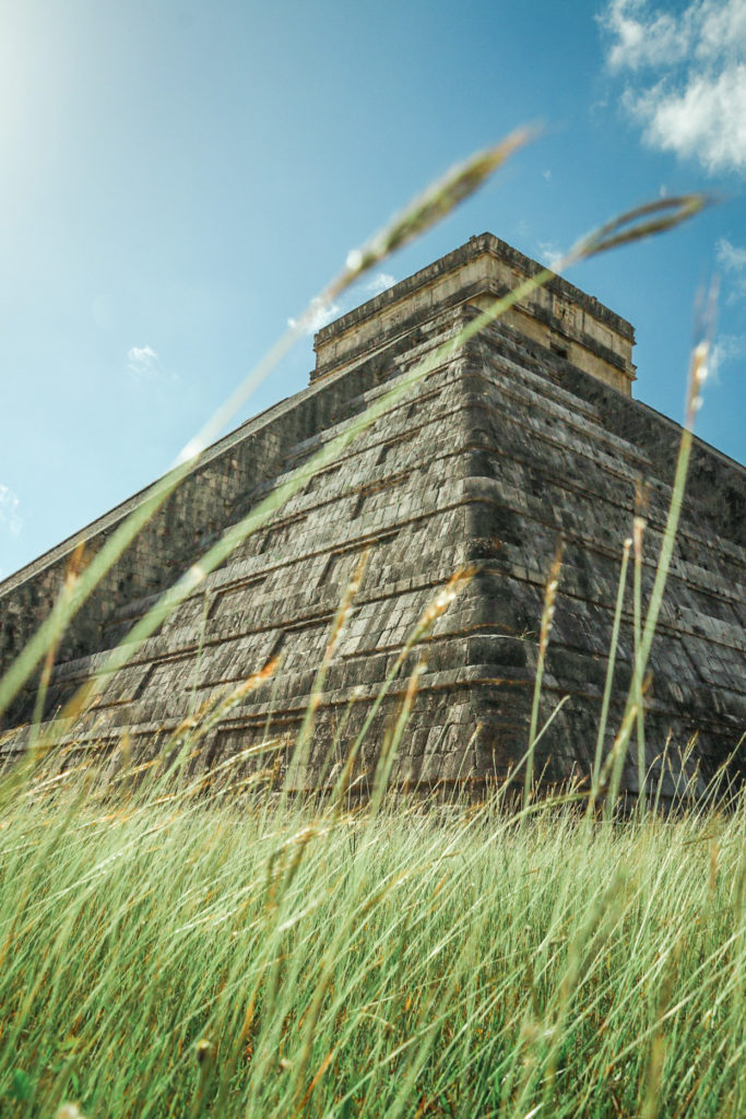 Tall grass in front of El Castillo, the central pyramid at Chichen Itza
