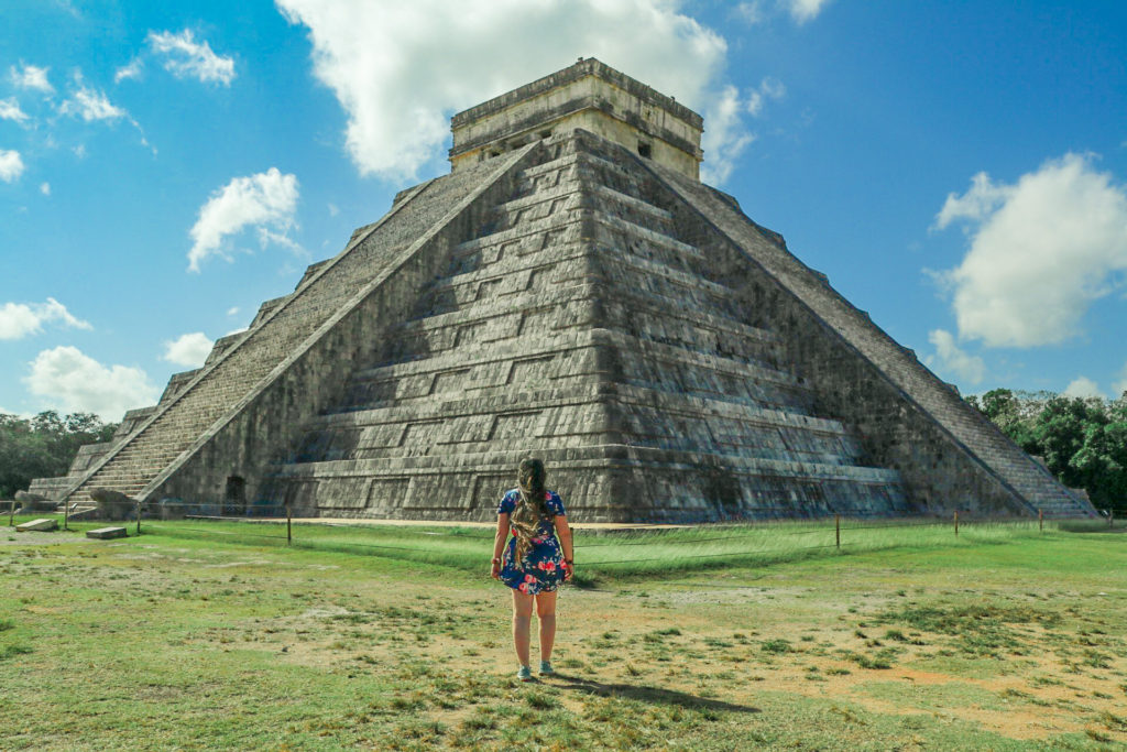 Standing alone in front of El Castillo, the famous pyramid at Chichen Itza