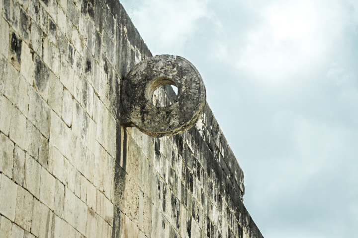 A circle of stone attached to the stone wall of the Field at Chichen Itza