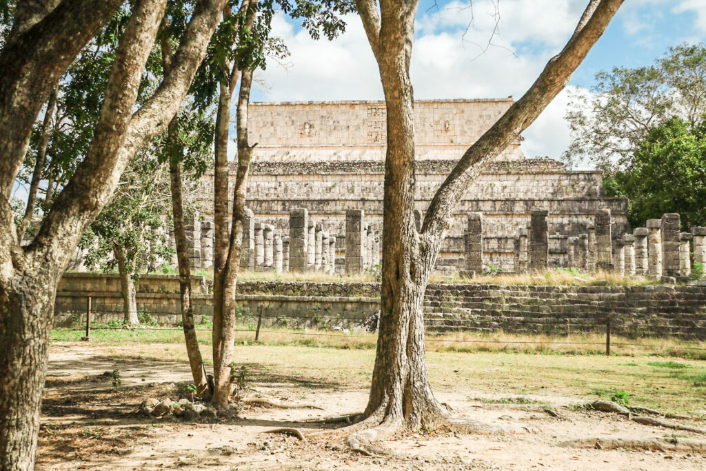 More buildings by trees at Chichen Itza