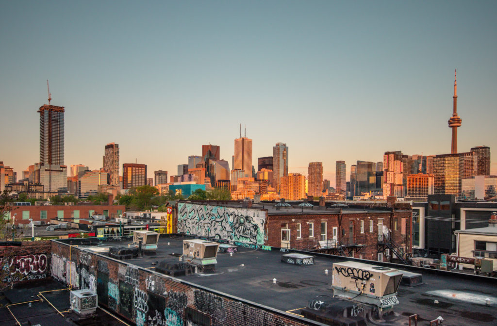 The entire skyline of Toronto at sunset from the top of the Kensington Market parking garage