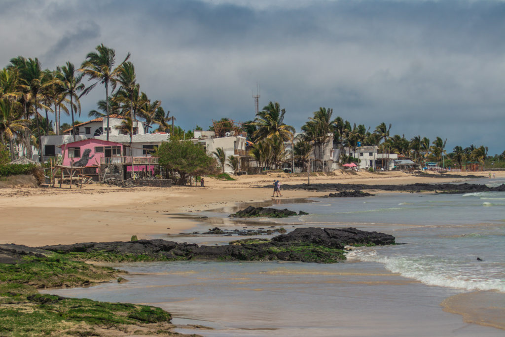 Small buildings next to the beach on Isabela, a perfect place to spend some time while solo backpacking in the Galapagos