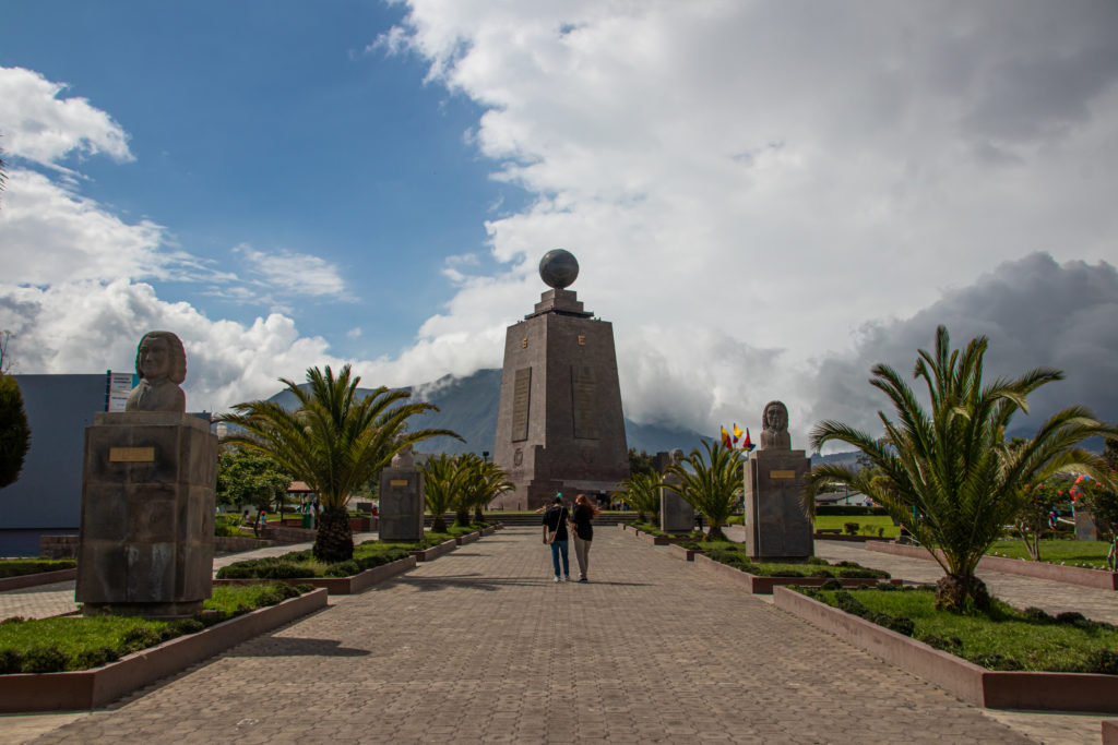 Walking up to the Mitad del Mundo monument near in equator line in Ecuador