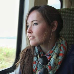 Image of a girl looking out a train window