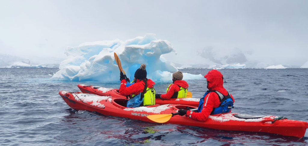 Kayaking through iceberg-filled water is one experience every backpacker in Antarctica should have