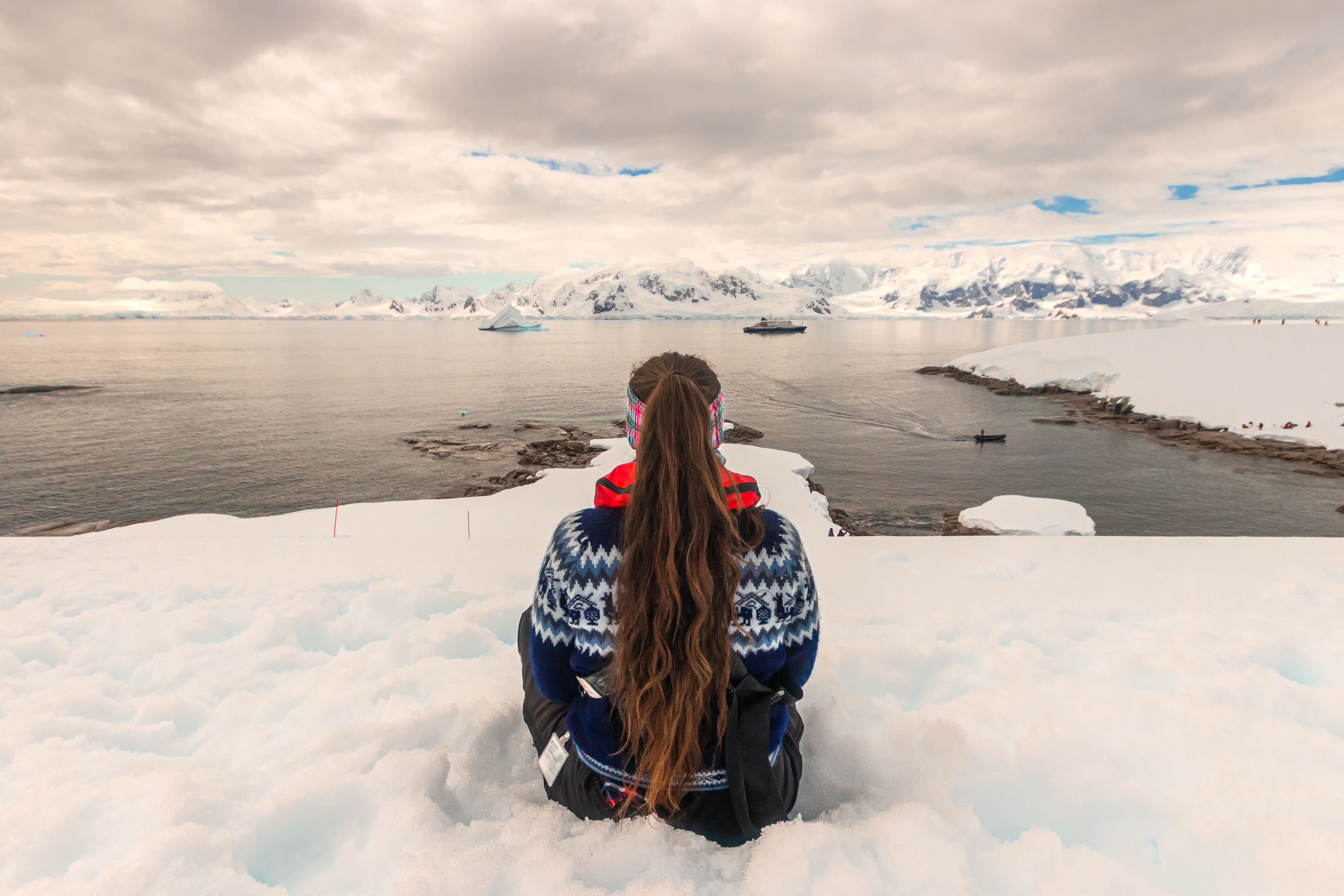 Sitting in the snow overlooking Charlotte Bay in Antarctica