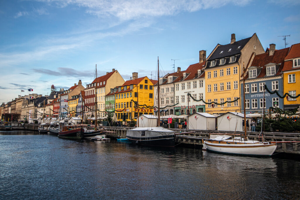Colourful houses and historical boats on the canal at Nyhavn, Copenhagen