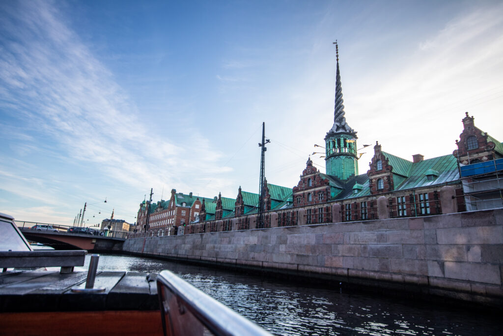 Børsen, the Stock Exchange Building in Copenhagen, seen from a boat on the canal