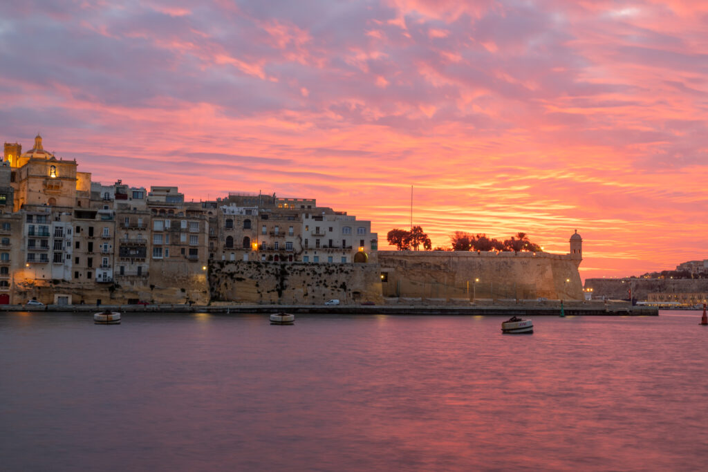 A vibrant sunset over Senglea, one of the Three Cities of Malta