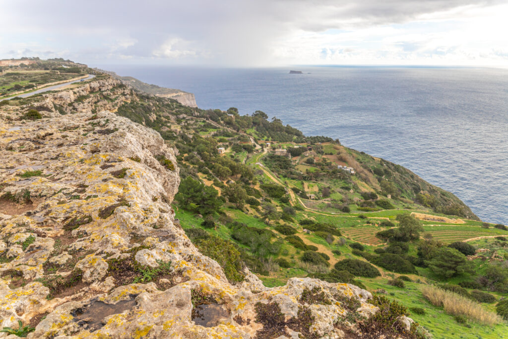 The Dingli Cliffs, with green fields rolling down to the sea, Malta