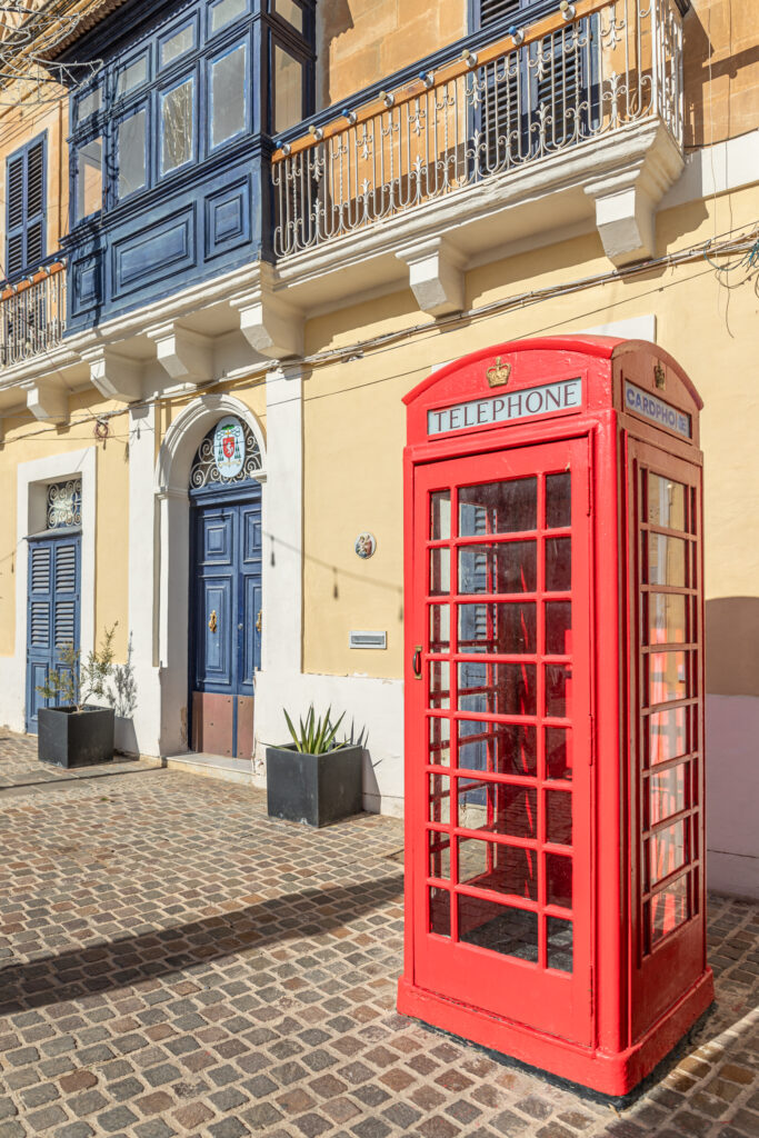 A red telephone box in Marsaxlokk, Malta
