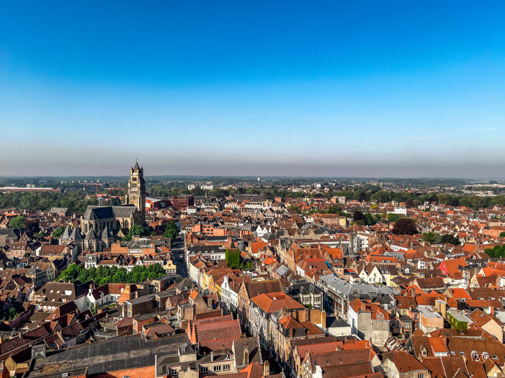 Looking out over the red rooftops and spires of Bruges from the top of the Belfry