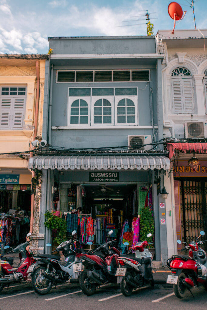 Motorcycles line the street in front of the colonial streets of Phuket's Old Town