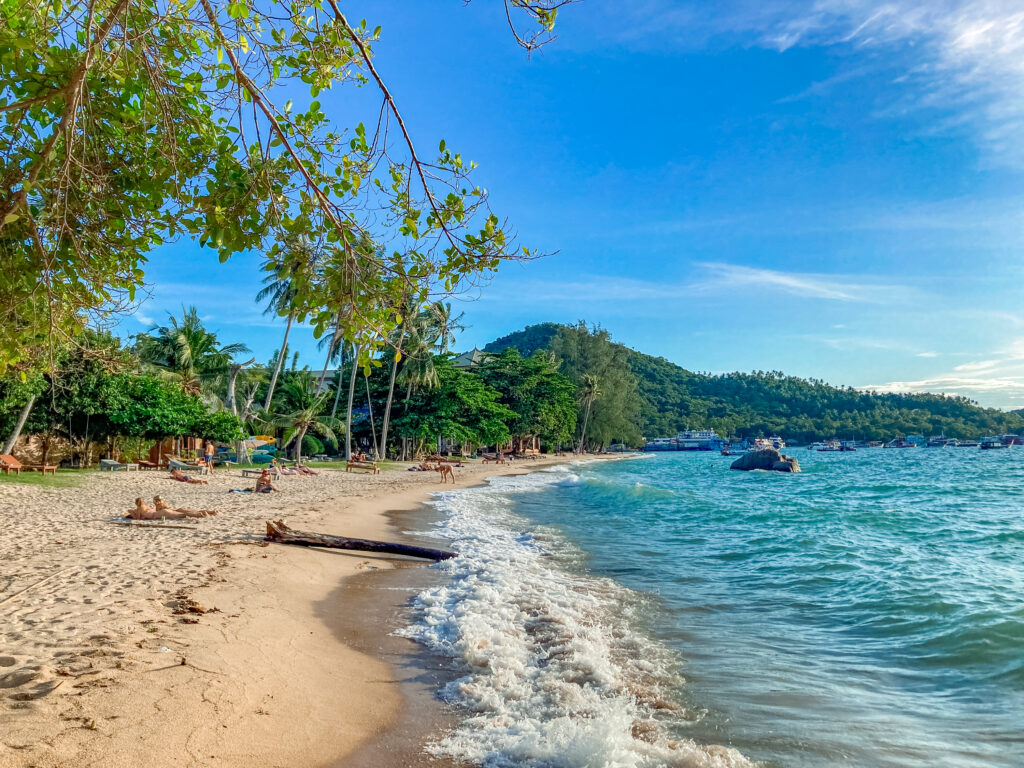 Sairee Beach on Koh Tao, with blue water, golden sand and greenery