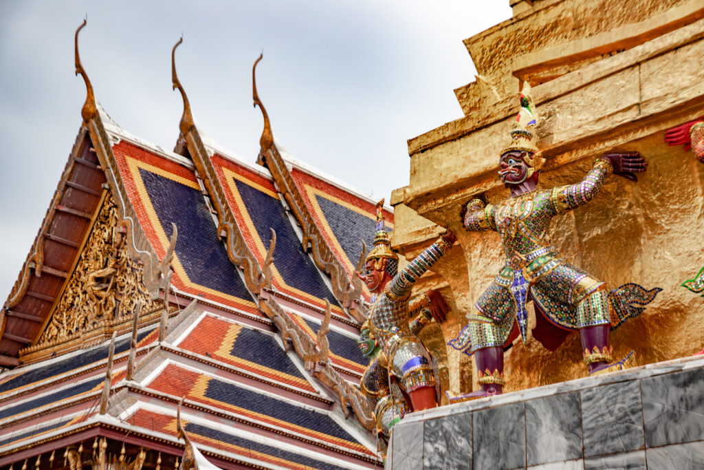 Ornate rooftops and statues at Bangkok's Grand Palace