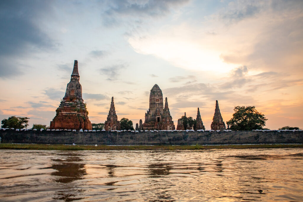 Wat Chaiwatthanaram silhouetted against the sunset in Ayutthya, Thailand
