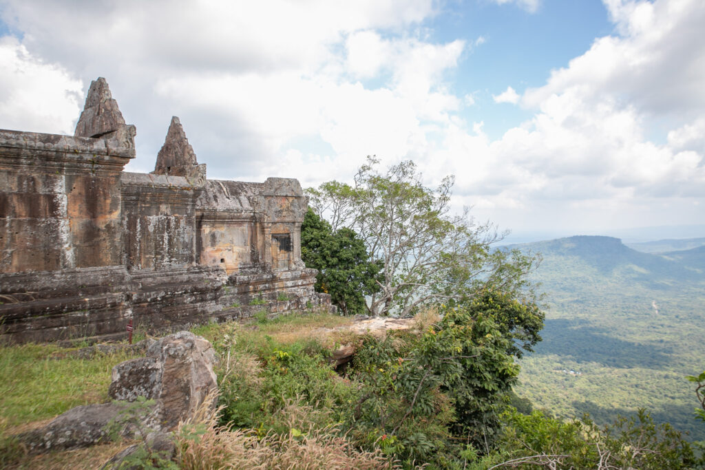 Temple ruins site on the edge of a cliff above a valley