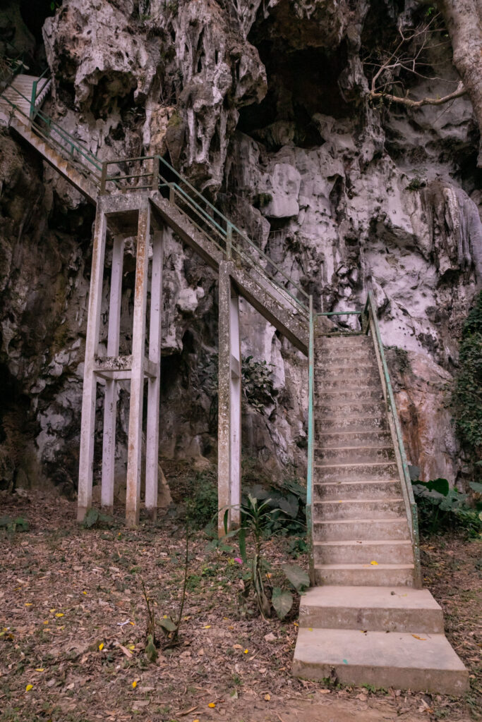 A stone stairs heading up a sharp, limestone cliff