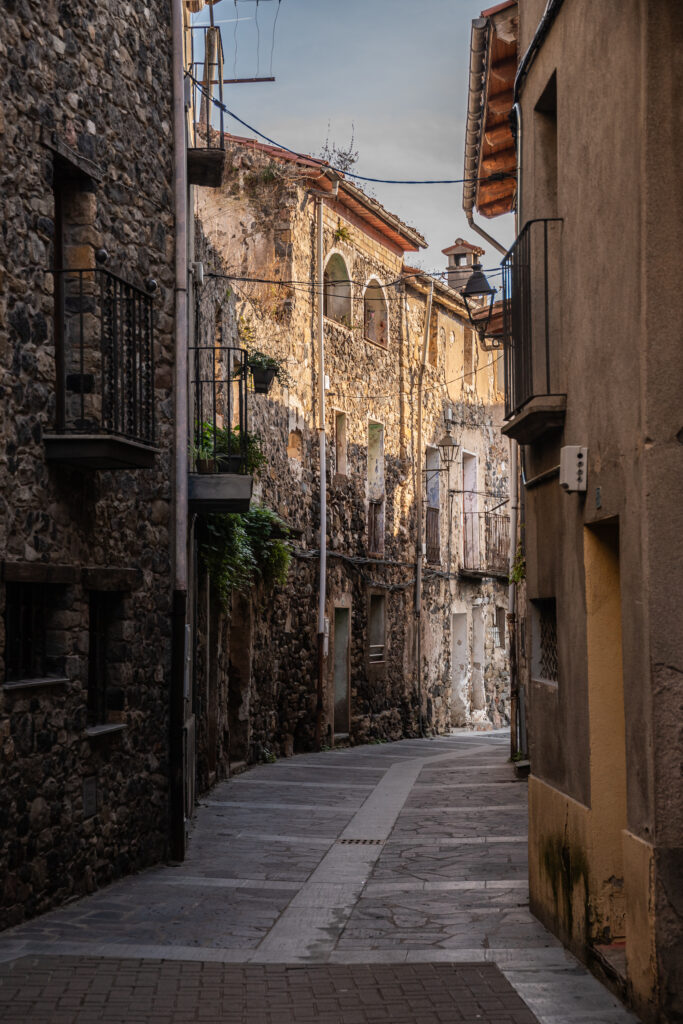 An empty street in a medieval town in La Garrotxa