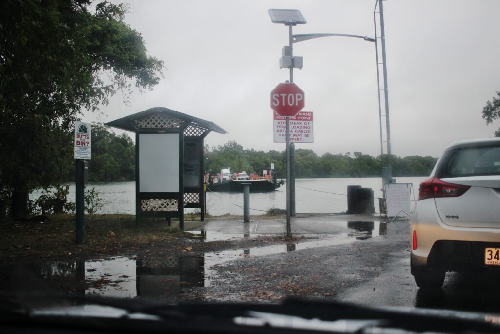 Driving onto a river crossing ferry in the rain